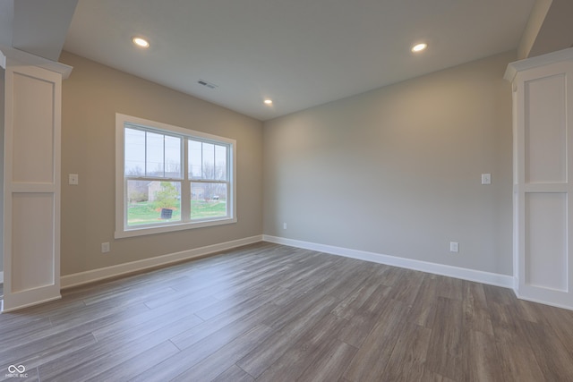 unfurnished room featuring light hardwood / wood-style floors