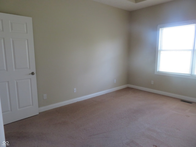 view of carpeted spare room