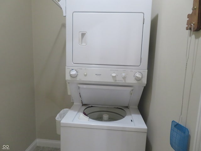 washroom featuring stacked washer and dryer