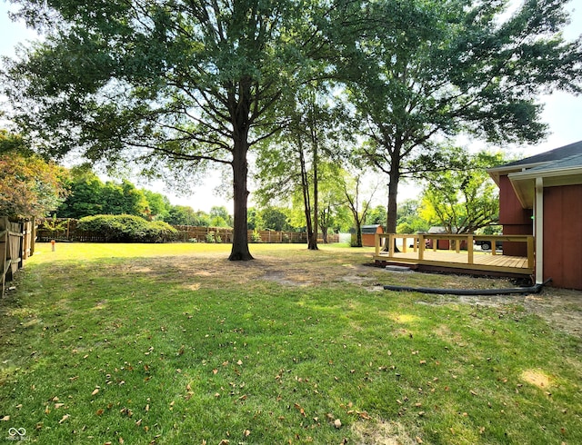 view of yard featuring a wooden deck