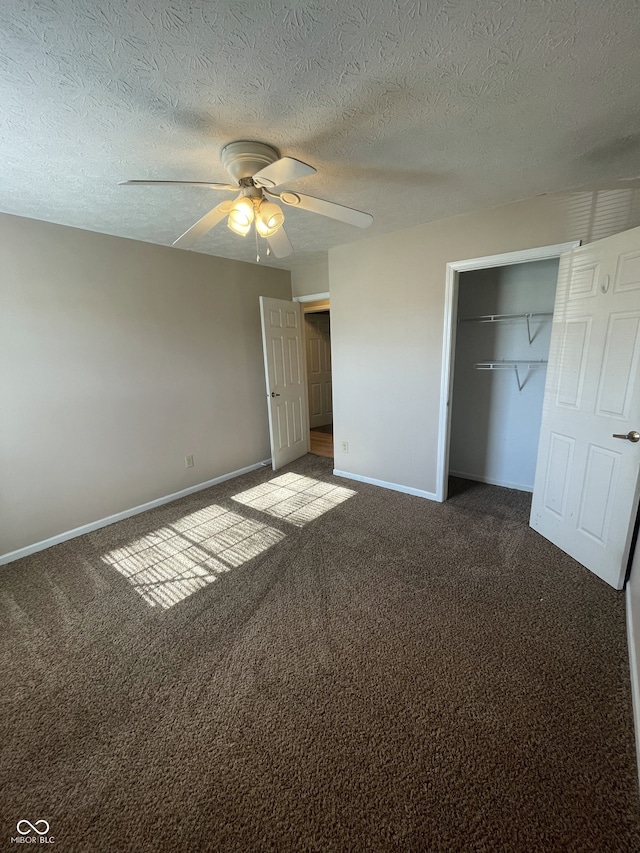 unfurnished bedroom featuring a textured ceiling, carpet, ceiling fan, and a closet