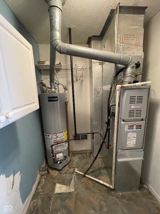 utility room featuring gas water heater