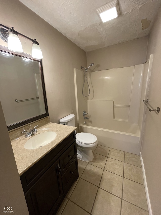 full bathroom featuring toilet, tile patterned flooring, a textured ceiling, vanity, and shower / bathtub combination