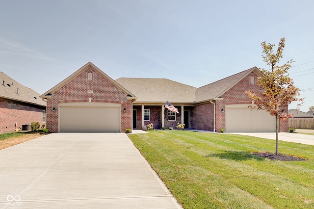 view of front of house with a garage and a front lawn