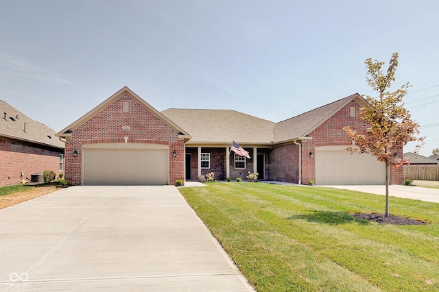 2841 Grandview Ln, Greenwood, IN 46143 - ranch-style house featuring brick siding, a front yard, driveway, and a garage