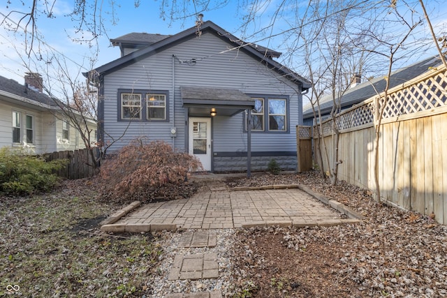 back of property featuring a patio