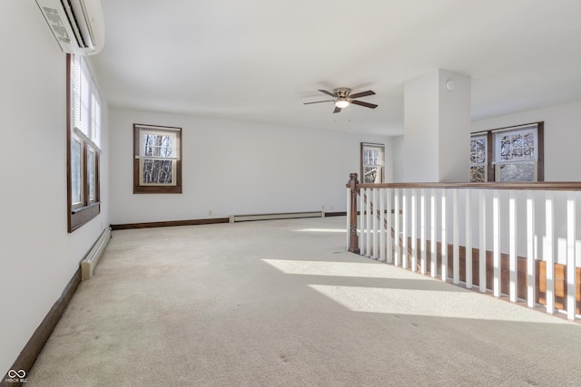 empty room with baseboard heating, ceiling fan, light carpet, and an AC wall unit