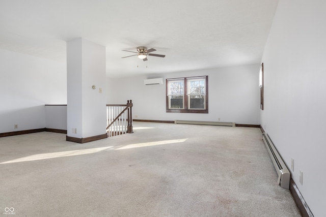 carpeted spare room with ceiling fan, a baseboard heating unit, and a wall mounted AC