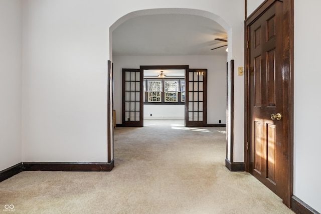 hallway featuring french doors and baseboard heating