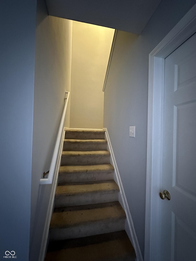 staircase with baseboards