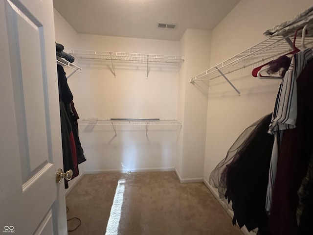 walk in closet with visible vents