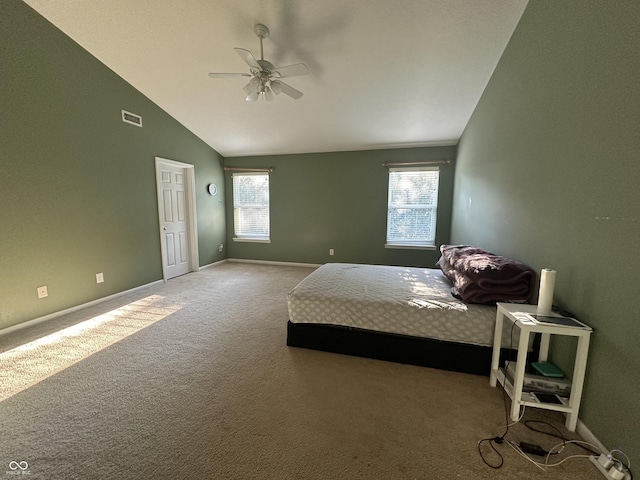 bedroom featuring baseboards, visible vents, high vaulted ceiling, carpet floors, and ceiling fan