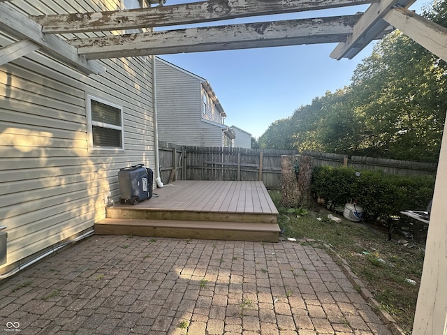 wooden deck with a patio, a fenced backyard, and a pergola