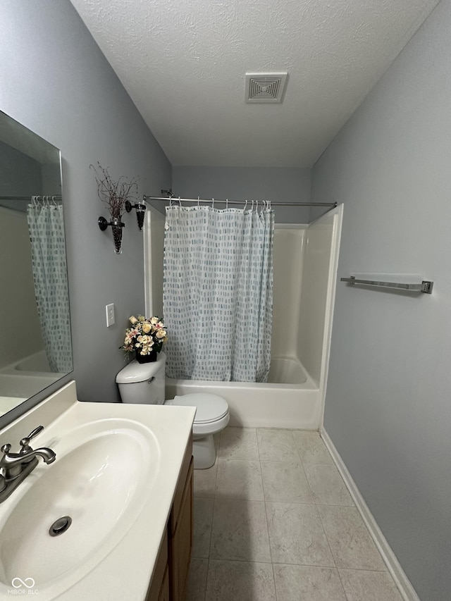 bathroom with vanity, visible vents, shower / bath combo, tile patterned floors, and toilet