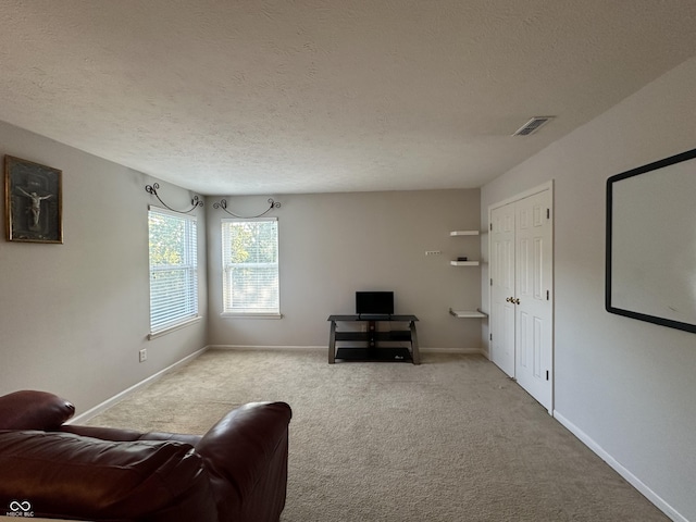 unfurnished room featuring visible vents, carpet floors, and baseboards