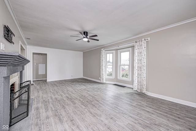 unfurnished living room featuring ceiling fan, ornamental molding, and hardwood / wood-style floors