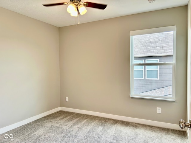 empty room with ceiling fan and carpet