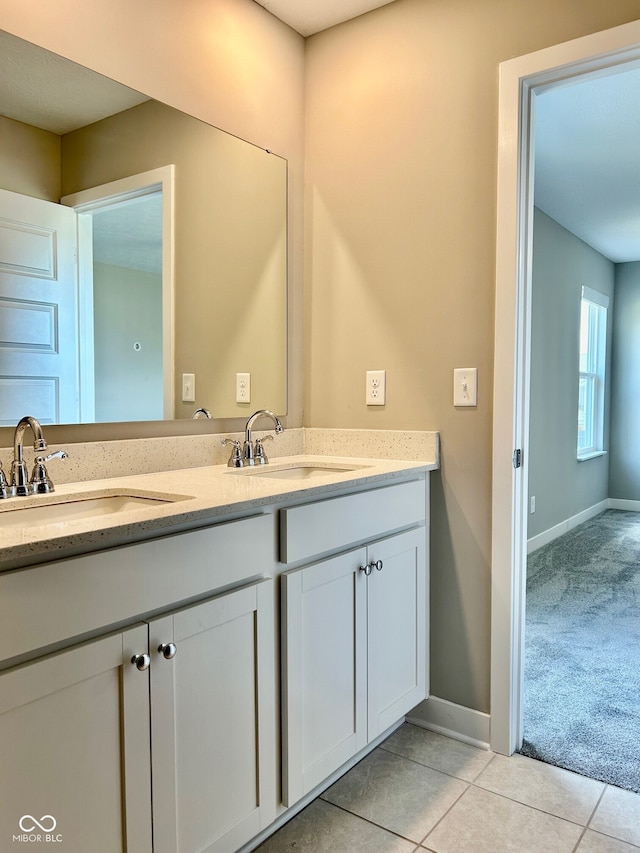 bathroom with vanity and tile patterned flooring