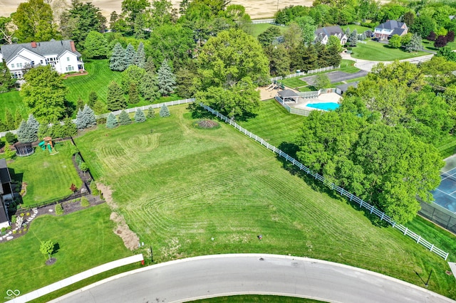 birds eye view of property with a rural view