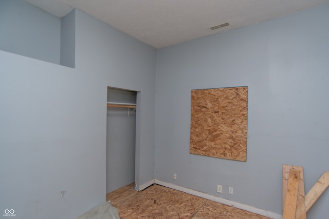 unfurnished bedroom with a closet