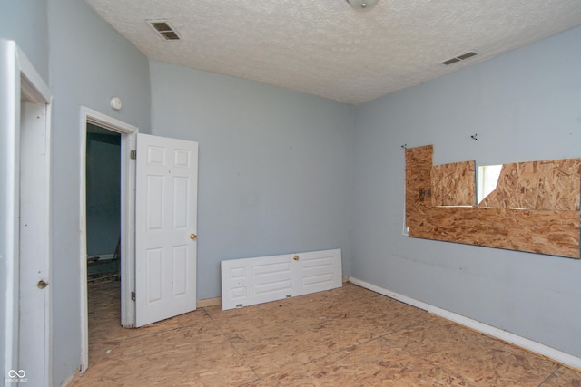 2363 N Gale St, Indianapolis, IN 46218 - unfurnished bedroom with a textured ceiling
