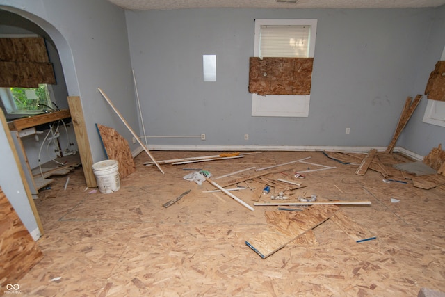 unfurnished living room with a textured ceiling