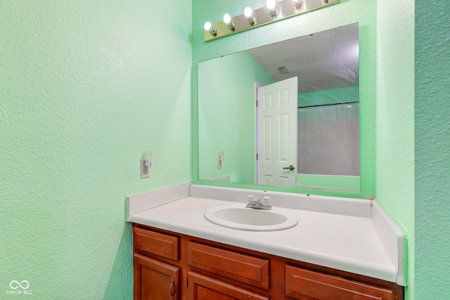 bathroom with a shower with curtain and vanity