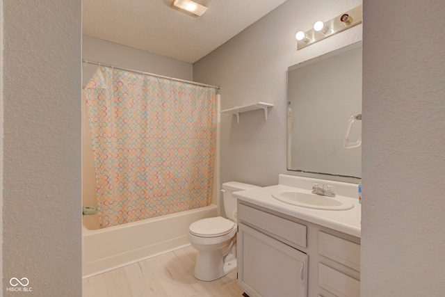 full bathroom featuring shower / bath combo, vanity, a textured ceiling, hardwood / wood-style floors, and toilet