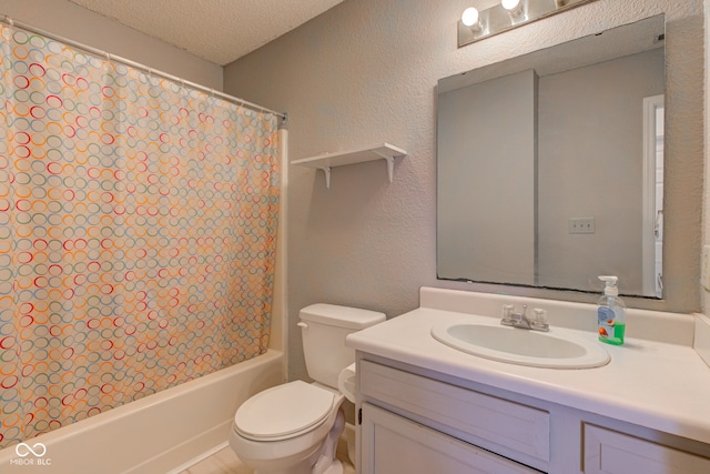 full bathroom featuring shower / tub combo, vanity, a textured ceiling, and toilet