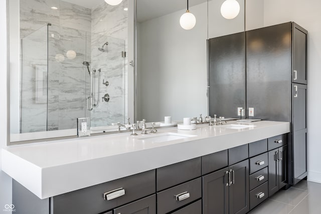 bathroom featuring tile patterned floors, an enclosed shower, and vanity