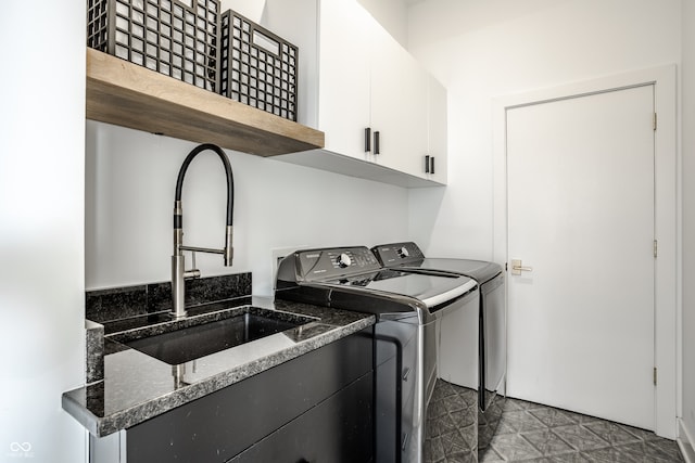 laundry room featuring a mail area, cabinets, washer and dryer, and sink