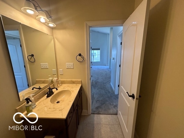 bathroom with tile patterned floors and vanity