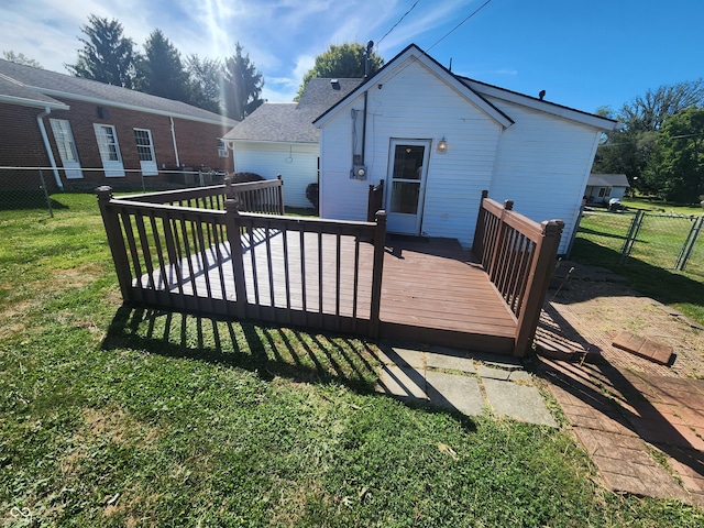 wooden terrace with a lawn