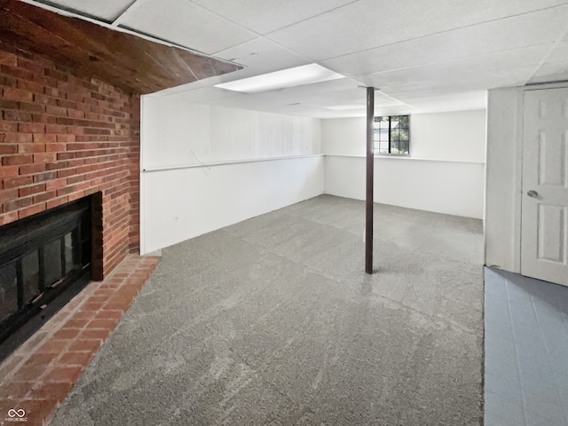 basement featuring a fireplace and carpet floors