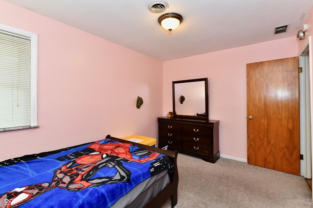 bedroom with light carpet