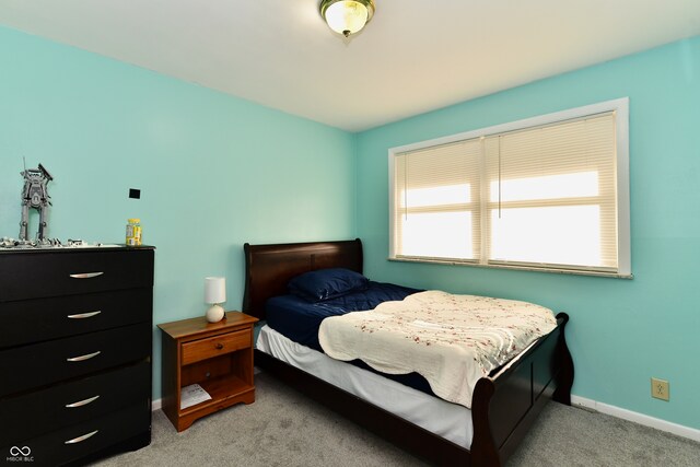 bedroom with light colored carpet