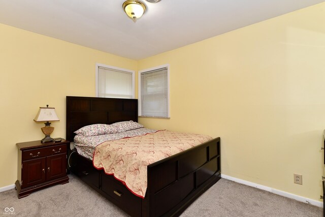 bedroom with light carpet