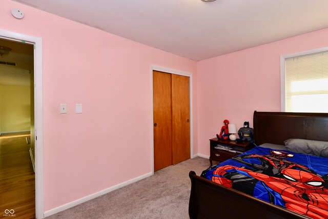 bedroom with a closet and carpet floors