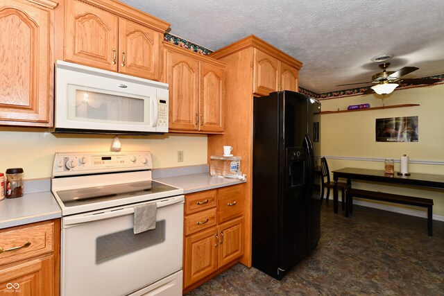 kitchen featuring white appliances, a textured ceiling, and ceiling fan