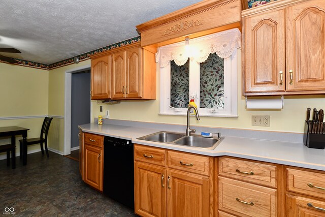 kitchen featuring black dishwasher, a textured ceiling, sink, and ceiling fan