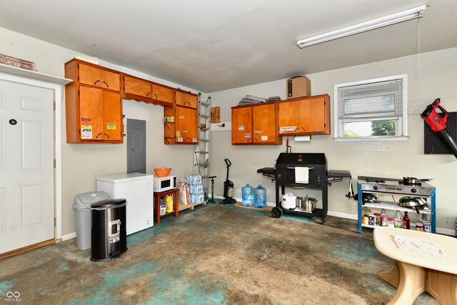 garage with refrigerator and electric panel