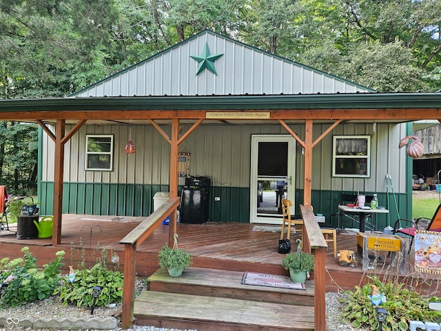 back of property featuring a wooden deck