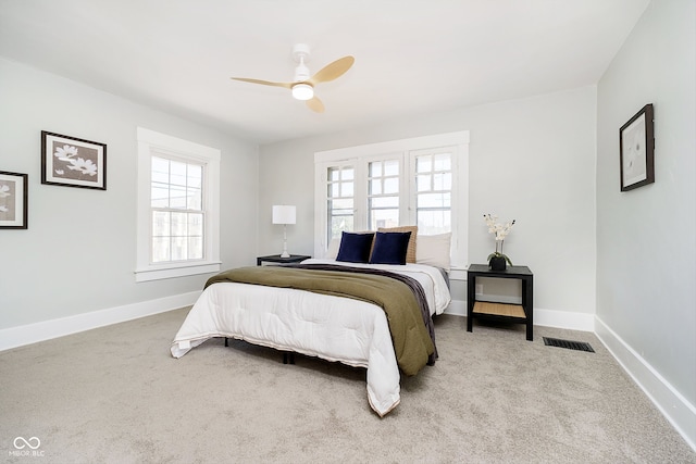 carpeted bedroom with ceiling fan