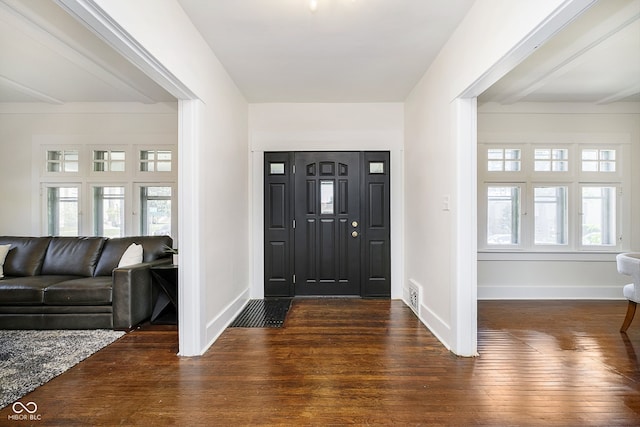 foyer with dark hardwood / wood-style floors