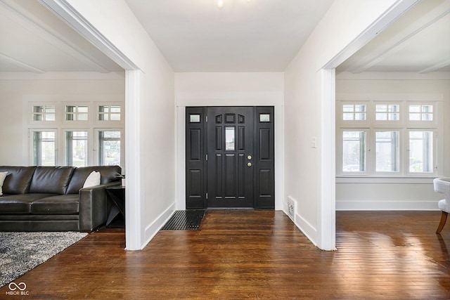 foyer featuring visible vents, plenty of natural light, and hardwood / wood-style floors