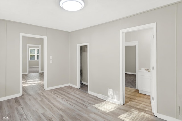 unfurnished room featuring light hardwood / wood-style flooring