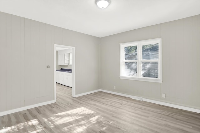 unfurnished room featuring light hardwood / wood-style flooring