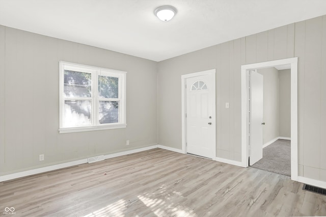 unfurnished bedroom featuring light wood-type flooring