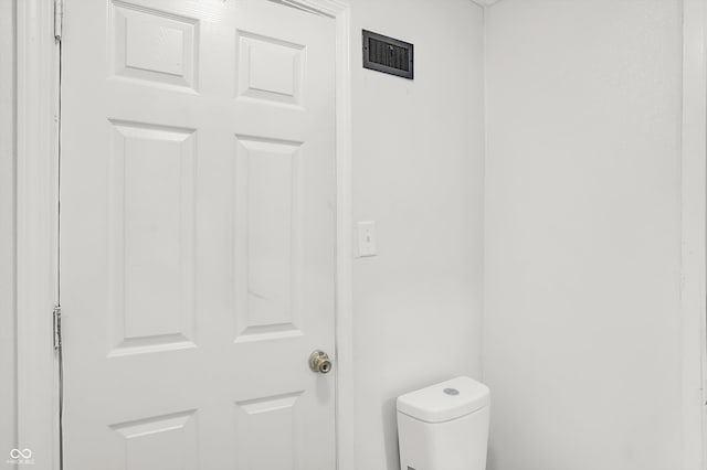 bathroom featuring toilet