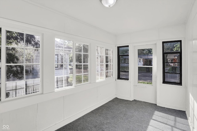 unfurnished sunroom featuring a healthy amount of sunlight